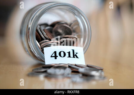 Money jar for savings and investment IRA 401k retirement or college rainy day Stock Photo