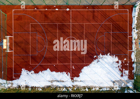 Top graphic view of basketball, volleyball or football court field red background, drone photography. Stock Photo