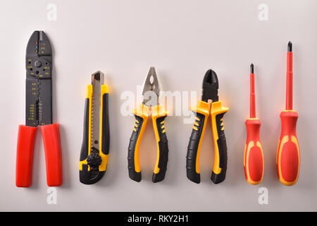 Tools aligned on white table top view. Horizontal composition. Top view. Stock Photo