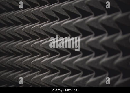 Musical background theme: grey soundproof coverage in recording studio. Close up view. Musical instruments. Live music. Music studio. Media production Stock Photo