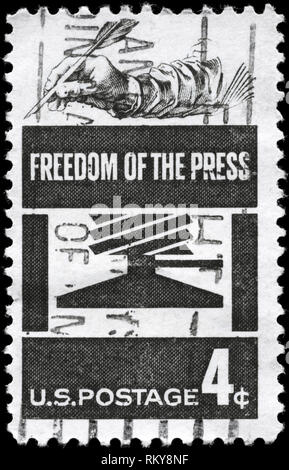 USA - CIRCA 1958: A Stamp printed in USA shows the Early Press and Hand Holding Quill, Freedom of the Press Issue, circa 1958 Stock Photo