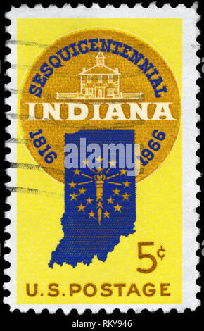 USA - CIRCA 1966: A Stamp printed in USA shows the Design features Sesquicentennial Seal; Map of Indiana with 19 Stars & Old Capitol at Corydon, circa Stock Photo