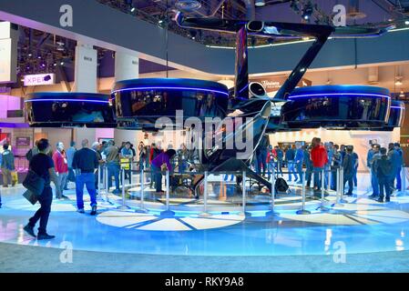 Bell Nexus 'Flying Car' hybrid-electric vertical takeoff and landing (eVTOL) taxi on display in their exhibit booth at CES, Las Vegas, USA. Stock Photo