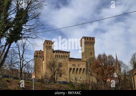 Vignola, Emilia Romagna, Italy. January 2019. The fortress of Vigonola seen from the south, overlooking the bank of the river Panaro. The cars, along  Stock Photo