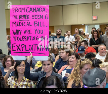 Detroit, Michigan - A Canadian woman holds a sign about the virtues of Canada's single payer health care system during a rally at Wayne State Universi Stock Photo