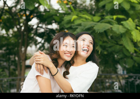 young pretty girlfriends over nature background, in the garden Stock Photo