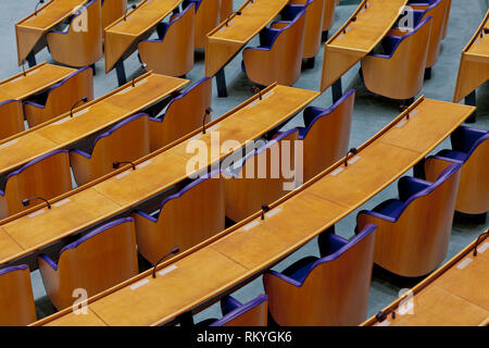 Interior detail of the empty plenary hall of the House of Representatives in The Netherlands with the chairs for the representatives Stock Photo