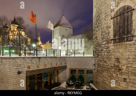 Winter night at Tallinn city walls with Alexander Nevsky orthodox church in the distance. Stock Photo