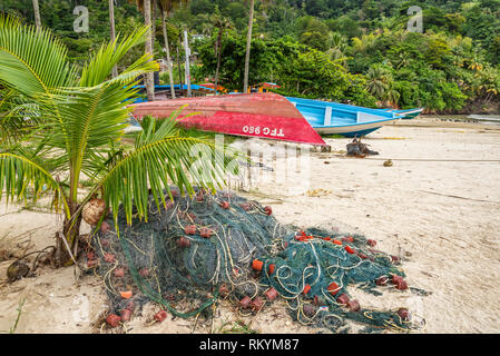 Fishing net and boats on the beach at Maracas Bay, Trinidad island, Trinidad and Tobago. Stock Photo