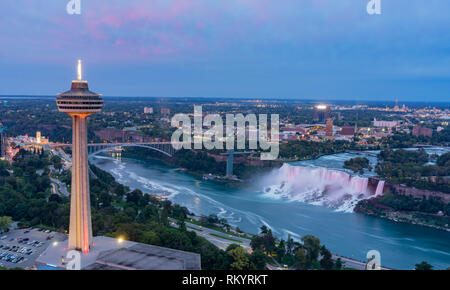 Night aerial view of the Skylon Tower and the beautiful Niagara Falls at Canada Stock Photo