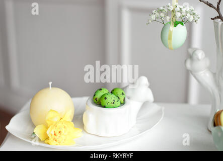 Happy Easter. Congratulatory easter background. Easter eggs and flowers. Stock Photo