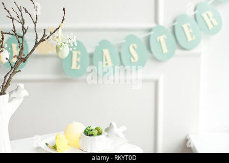 Happy Easter. Congratulatory easter background. Easter eggs and flowers. Stock Photo
