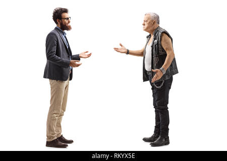 Full length profile shot of a bearded man having a conversation with an angry male punker in a leather vest isolated on white background Stock Photo