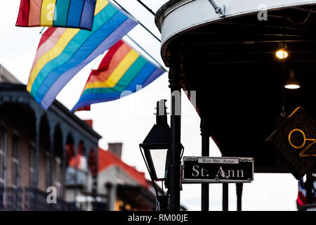 New Orleans, USA - April 22, 2018: Old town Bourbon street in Louisiana town city with Saint Ann building party nightlife by restaurant outdoor bar in Stock Photo