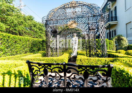 New Orleans, USA - April 23, 2018: Old street historic Garden district in Louisiana famous town city with real estate house landscaping decoration of  Stock Photo