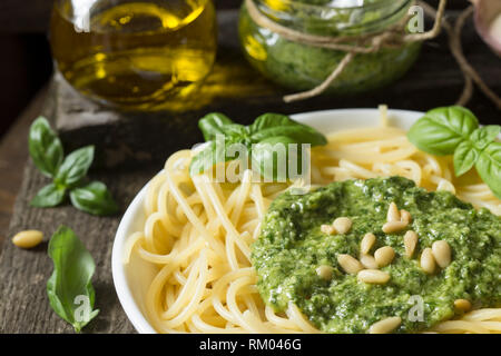 Spaghetti with pesto sauce on a white plate Stock Photo