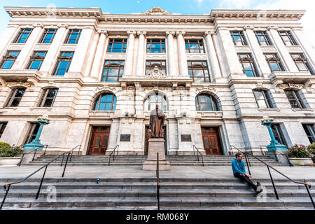 New Orleans, USA - April 23, 2018: Old town Royal street in Louisiana famous town city with exterior entrance architecture of Supreme Court building Stock Photo