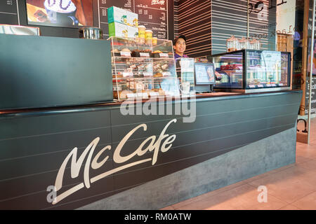 DUBAI, UAE - CIRCA NOVEMBER, 2016: McCafe at Dubai International Airport. McCafe is a coffee-house-style food and drink chain, owned by McDonald's. Stock Photo