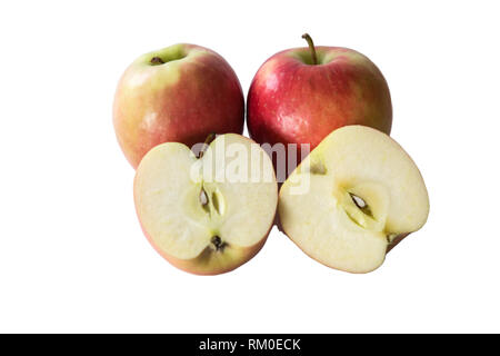 Fresh whole and freshly chopped apples on a white background Stock Photo