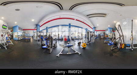 360 degree panoramic view of MINSK, BELARUS - JULY, 2017: full seamless panorama 360 by 180 angle view in interior of big stylish fitness club with sports equipment and simulators