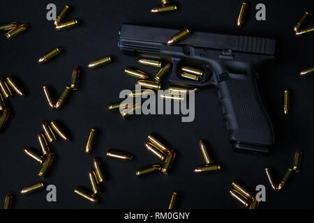 Gun and ammunition on black background Stock Photo