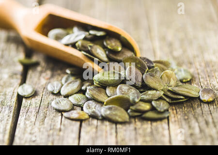 Download Peeled Pumpkin Seeds In Wooden Bowl Isolated On White Background Stock Photo Alamy PSD Mockup Templates