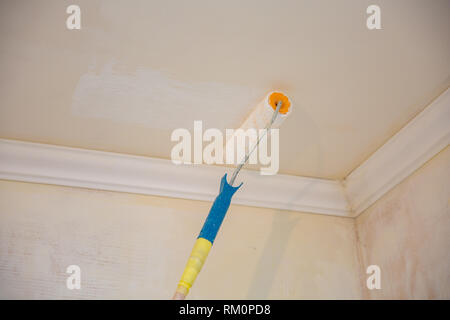 Painting A Gypsum Plaster Ceiling With Paint Roller Repairs Stock