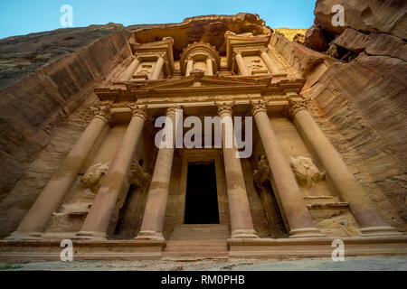 The imposing first century ruins of Al Kazneh rise overhead in Petra in Jordan. Stock Photo