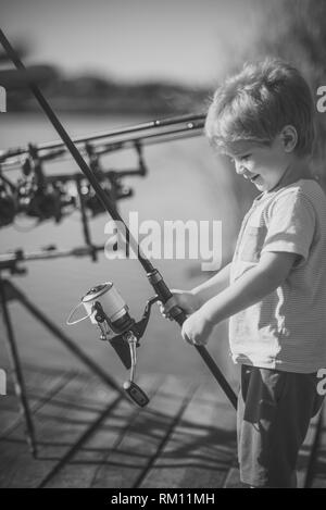 Boy child kid with rod and reel Black and White Stock Photos & Images -  Alamy