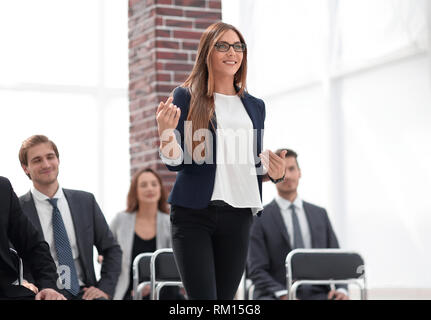Businesswoman Addressing Delegates At Conference Stock Photo