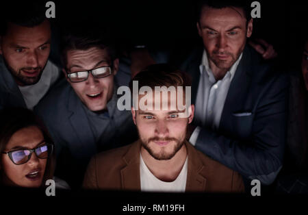 close up. the programmer and his colleagues are working late Stock Photo