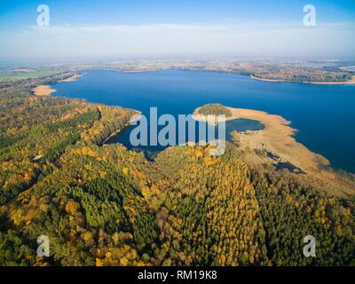 Aerial view of beautiful landscape of Mazury region during autumn season, Mamry Lake in the background, Poland