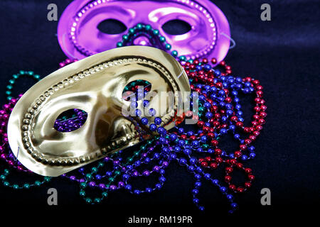 Mardi Gras masks with colorful beads Stock Photo