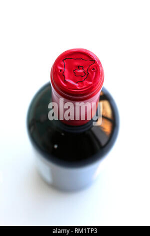 Red wine bottle with map of Spain, Tierra de Castilla, with white label, isolated on white background, close-up Stock Photo