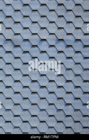 Modern roofing and decoration of chimneys. Flexible bitumen or slate shingles in hexagon shape. Top view texture Stock Photo