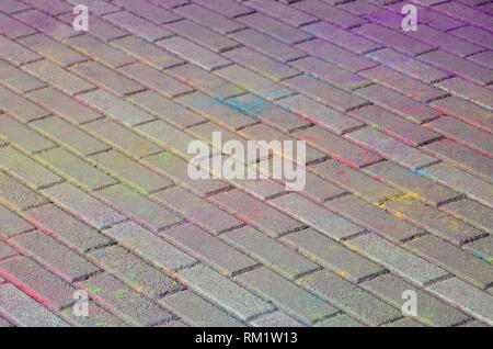 Multi colored earth, paving slabs, powder coated with dry colors at the Holi festival close up Stock Photo