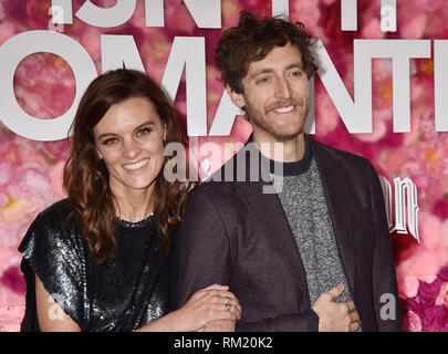 LOS ANGELES, CA - FEBRUARY 11: Frankie Shaw (L) and Thomas Middleditch arrive at the Premiere Of Warner Bros. Pictures' 'Isn't It Romantic' at The The Stock Photo