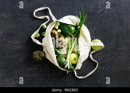 Healthy Food With Fabric Eco Bag Fruit and vegetable. Vegetarian Or Vegan Food On Dark Background Top View Flat Lay Stock Photo