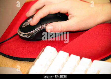 Hand with Computer Mouse Stock Photo