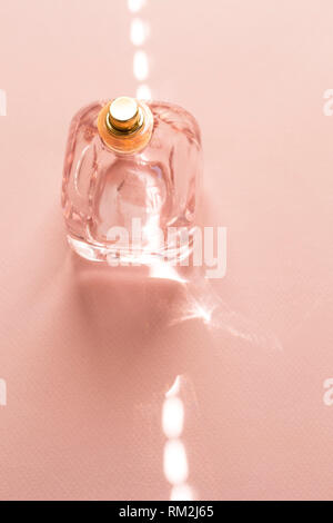 Perfume bottle with a ray of light Stock Photo