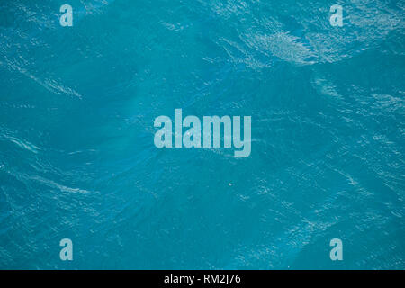 Blue wavy water surface as background Stock Photo