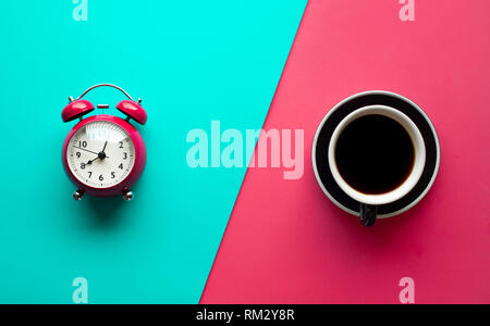 Refreshment concepts with coffee cup and alarm clock on pastel color Stock Photo