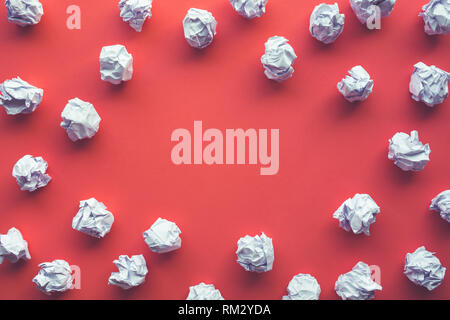 Creativity inspiration,ideas concepts with paper crumpled ball on red color background. Stock Photo