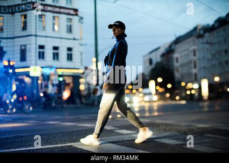 woman walking on street in Berlin, Germany