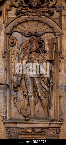 LUZERN, SWITZERLAND - APRIL 16: Knight on the wooden door at Hofkirche St. Leodegar on April 16, 2015 in Luzern. This is the most important church and Stock Photo