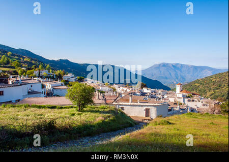 A view over Capileira, the highest and most northerly village in the Poqueira river gorge, in the Alpujarra region in the Sierra Nevada, Andalusia, Sp Stock Photo