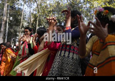 Dhaka, Bangladesh. 13th Feb, 2019. Girls dance as they participate to celebrate Basanta Utsab (Spring Festival) in the Dhaka University campus. Credit: MD Mehedi Hasan/ZUMA Wire/Alamy Live News Stock Photo