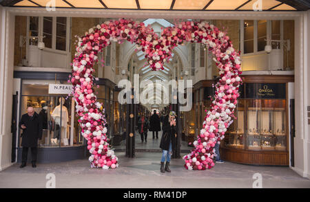 Mayfair, London, UK. 13 February, 2019. A giant pink heart decorates the entrance to Burlington Arcade for Valentines Day in the heart of the capital’s shopping destination. Credit: Malcolm Park/Alamy Live News. Stock Photo