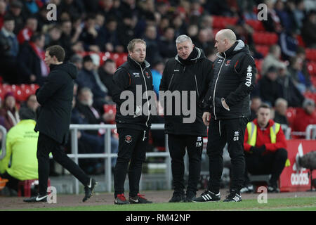 Sunderland, UK. 12th Feb, 2019. SUNDERLAND, UK. 12TH FEBRUARY. Blackpool manager Terry McPhillips with assistant manger Gary Brabin (right) and first team coach Ian Dawes (left) during the Sky Bet League 1 match between Sunderland and Blackpool at the Stadium Of Light, Sunderland on Tuesday 12th February 2019. (Credit: Mark Fletcher | MI News) Credit: MI News & Sport /Alamy Live News Stock Photo