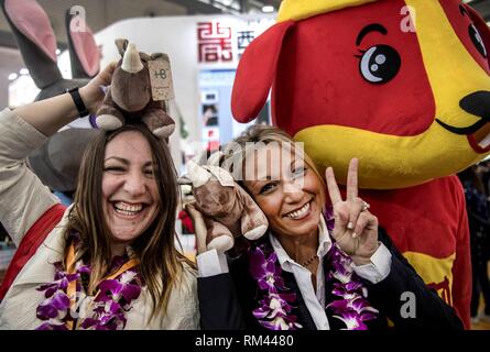 (190213) -- BEIJING, Feb. 13, 2019 (Xinhua) --     Foreign tourists pose for a photo with mascot during a Silk Road international tourism expo in Xi'an, northwest China's Shaanxi Province, March 30, 2018.     Foreign travelers made 30.54 million trips to China in 2018, a 4.7 percent increase than that of 2017, according to China's Ministry of Culture and Tourism.     Travelers stayed at least one night in China on 23.64 million of the trips, a growth of 5.2 percent than the figure of 2017, said a post on the ministry's website Tuesday.     It said foreign travelers spent 73.1 billion U.S. doll Stock Photo